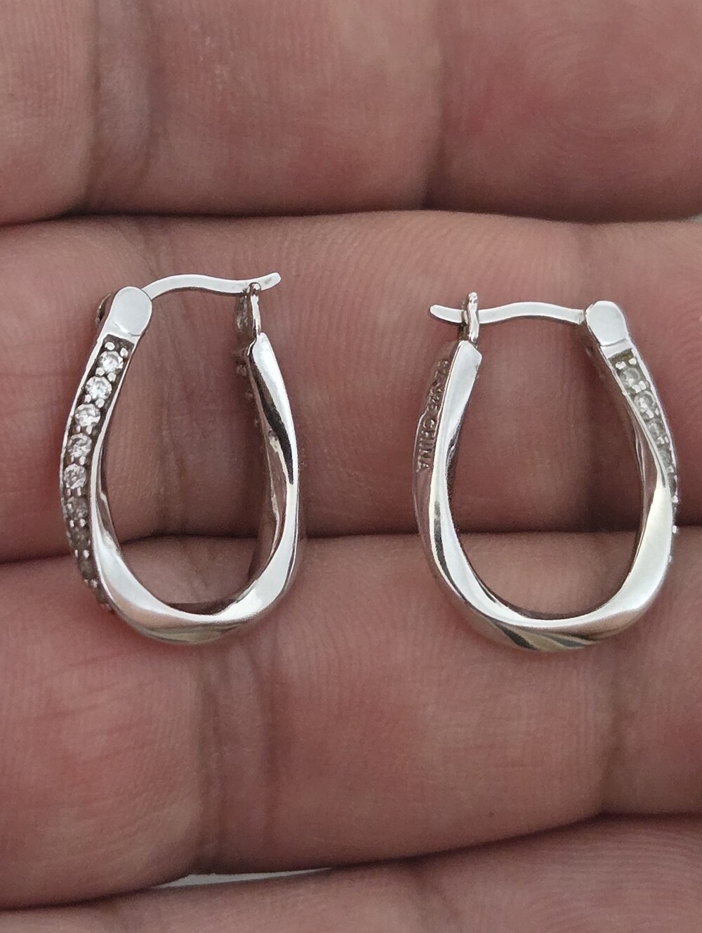 Sterling Silver Twist Hoop Earrings with CZ Accents - Silver